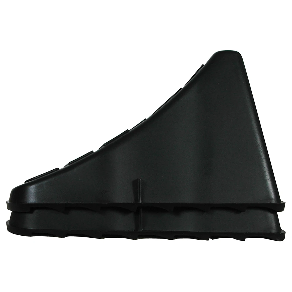 High Impact Polymer Trailer Wheel Chocks for Stability A pair of high impact polymer wheel chocks placed under trailer tires.