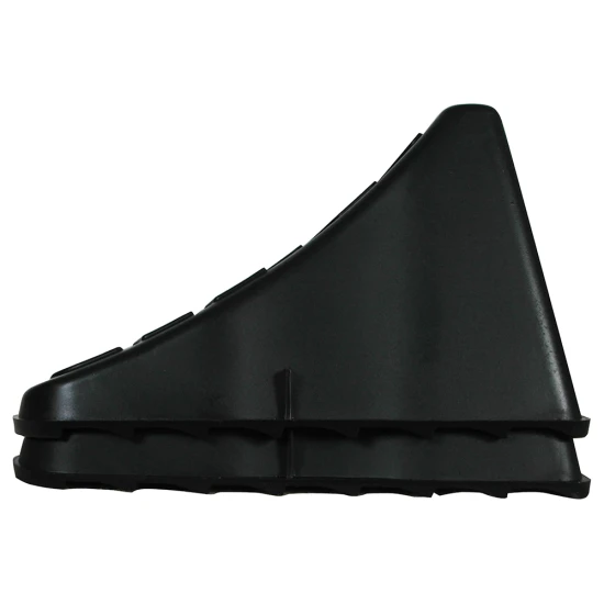 High Impact Polymer Trailer Wheel Chocks for Stability A pair of high impact polymer wheel chocks placed under trailer tires.