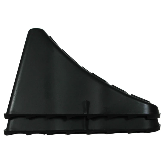 High Impact Polymer Trailer Wheel Chocks for Stability A pair of high impact polymer wheel chocks placed under trailer tires.